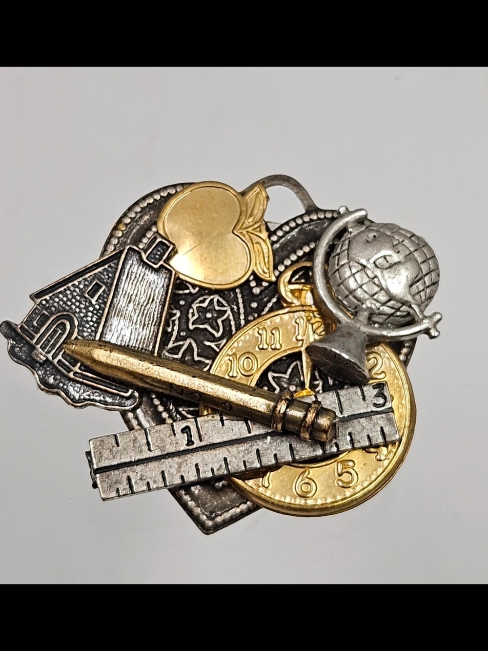 Source Unknown Gold & Silver School-Themed Lapel Pin